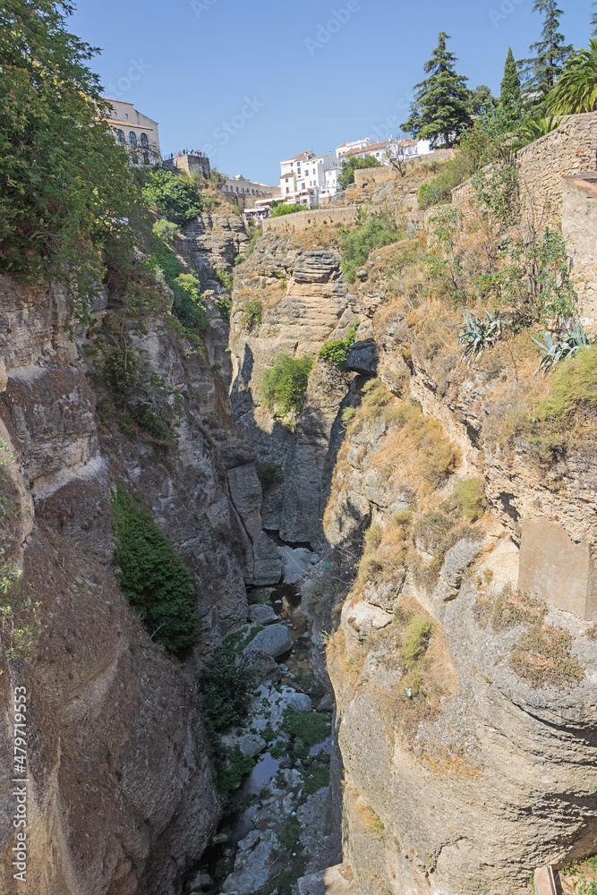 The Guadalevin gorge between the new and the old bridge dividing the new and the old part of Ronda