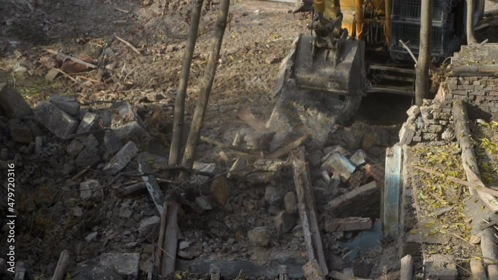Destruction of ancient historical buildings, excavator breaks down an old vintage house. construction of new buildings on the site of abandoned housing concept. Urban Renewal 4k High quality video