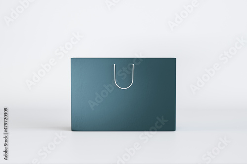 Empty blue shopping bag on light background with mock up place. Purchase and commerce concept. 3D Rendering.