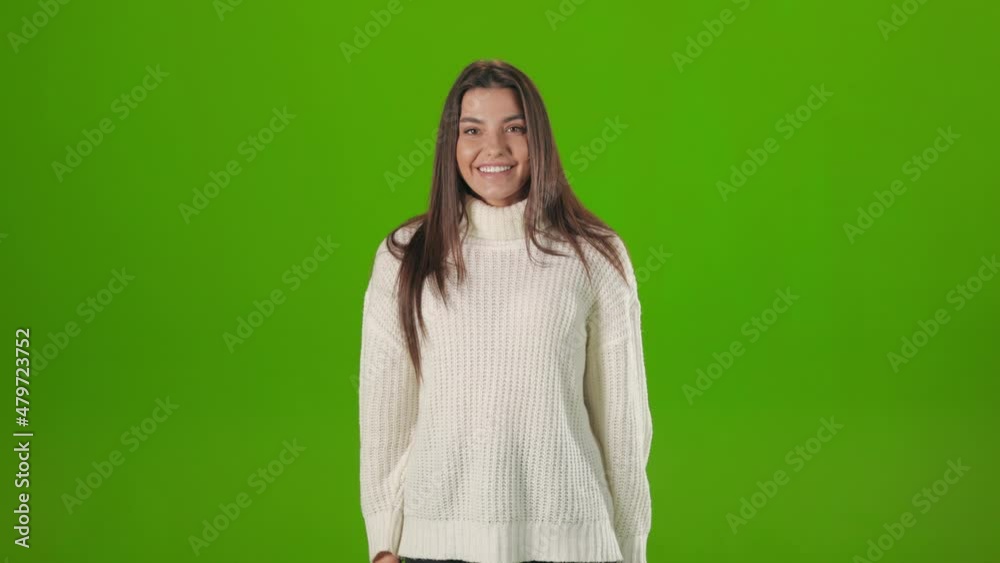 Excited caucasian woman standing over green background and open mouth from unexpected surprise. Sincere emotions of pretty lady. Excited caucasian woman standing over green background and open mouth from unexpected surprise. Sincere emotions of pretty lady.