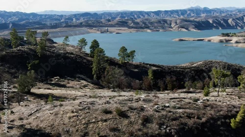 Castaic Lake and dam with abandoned campground in foreground photo