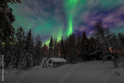 Northern Lights from the view of a cabin