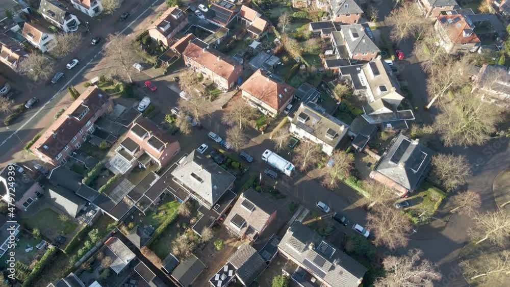 Aerial of garbage truck standing still on street in a quiet suburban neighborhood Aerial of garbage truck standing still on street in a quiet suburban neighborhood