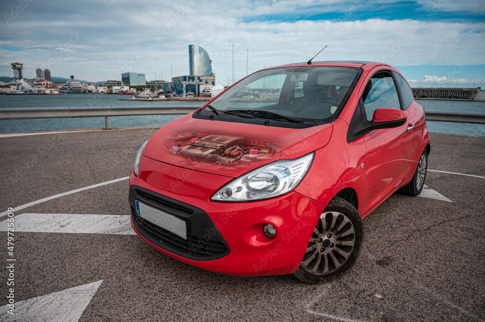 Small red city utility car, transparent bonnet Small red city utility car, transparent bonnet
