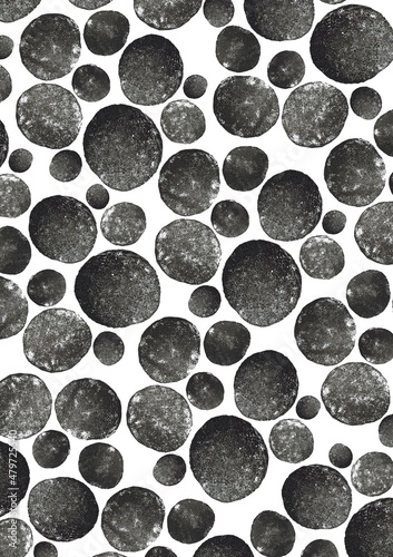 Pattern with circles.Linocut. Ink printing.Black and white background. Texture.