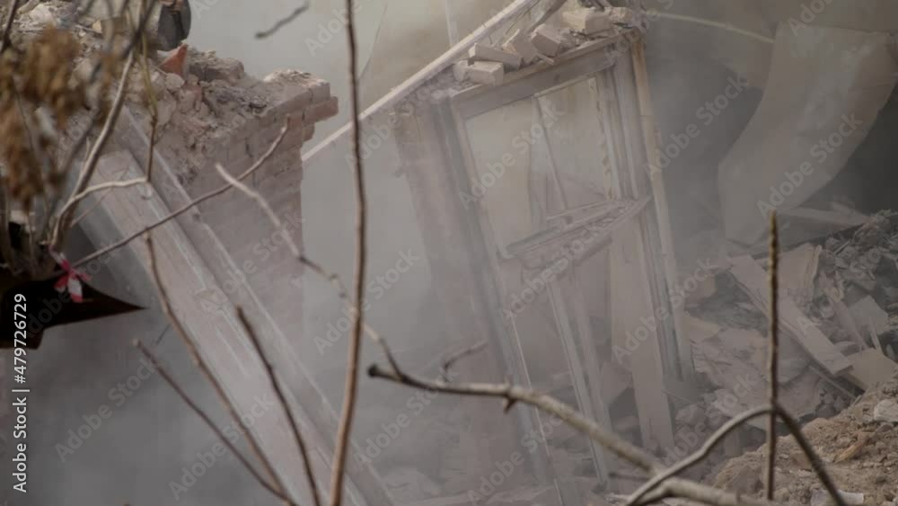 Ruined old brick house. Aftermath of the earthquake. Earthquake consequences concept. Broken wooden window in smoke of ruins. 4k high quality video