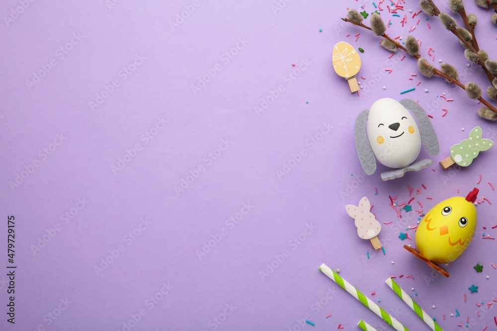 Easter holiday concept with cute handmade eggs, chicks and bunny on purple background.