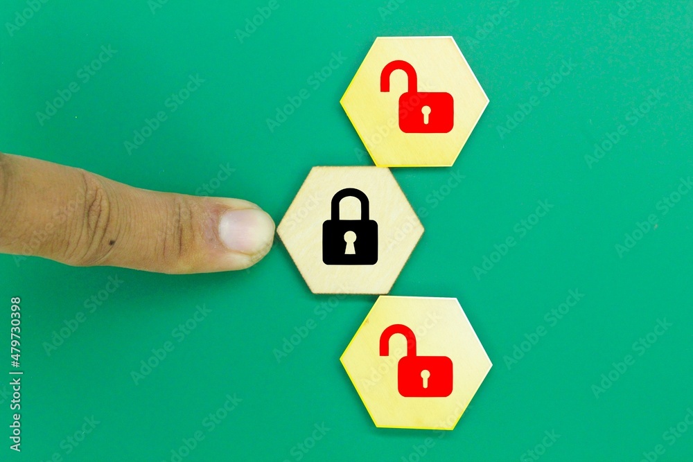 Obraz premium hexagon with with one lock icon locked and two more unlock locks. the concept of safety