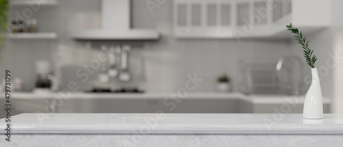Copy space on kitchen countertop over blurred modern kitchen room photo