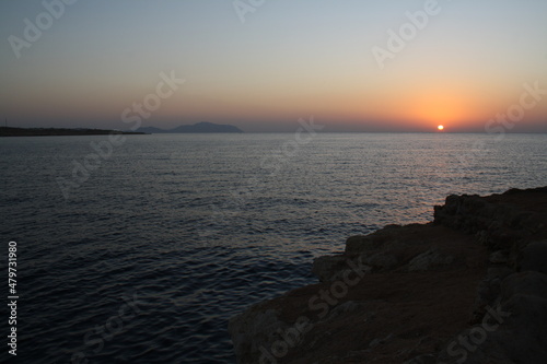 sun disc over blue sea