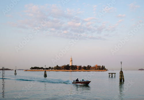 Venezia. Isola degli Armeni con barca nel canale navigabile. photo