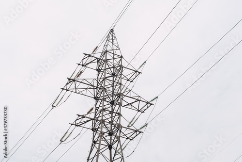 Power transmission lines and gray sky
