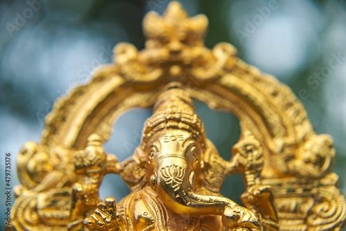 close up of lord ganesha golden statue