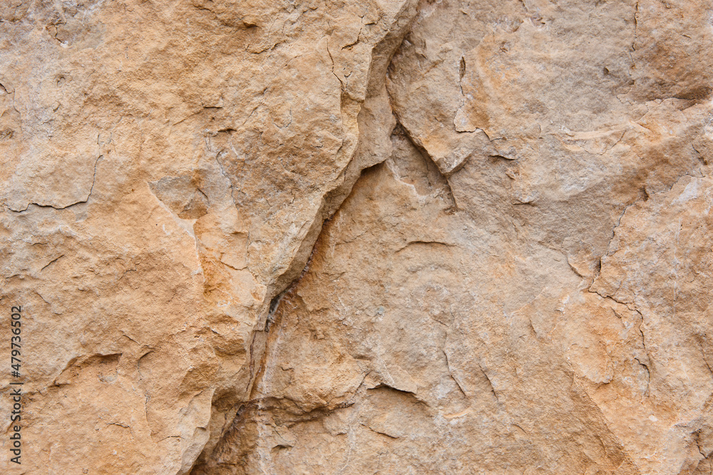 Natural stone background detail in warm tone. Texture