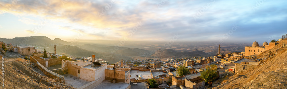 Panorama of the old city of Mardin, Turkey at sunrise. Cityscape view to the minaret of the Grand mosque and Zinciriye Madrasah