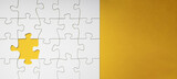 Empty white details of puzzle on yellow background banner panorama, with space for text