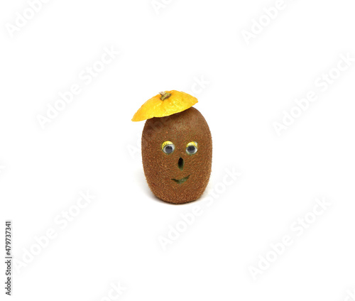 Kiwi. cheerful kiwi with eyes, nose and mouth, on an isolated white background. fruit carving. place for text. Table decoration.