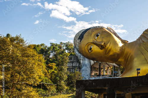 Close up the head of big sleeping buddha statue at Wat  Pasawangbun temple , Chonburi province , Thailand photo