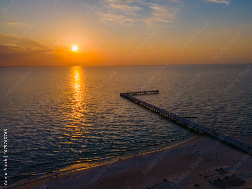 Aerial view of Palanga pedestrians bridge to the Baltic sea and a sunset in horizon