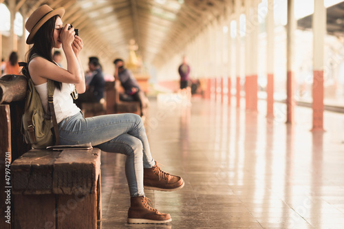 young asian beautiful girl tourist travel taking photo city street, journey backpack adventure by train concept.