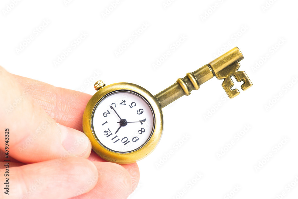 Key-shaped pocket watch in hand isolated on white Key-shaped pocket watch in hand isolated on white