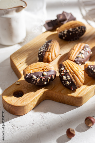 Vanilla madeleine cookies with chocolate and nuts