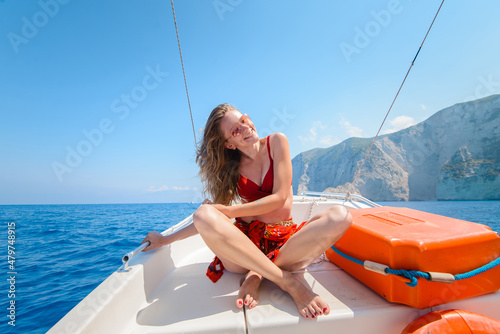 Obraz na płótnie Smiling Woman on Sailboat Enjoying Vacation w salonie