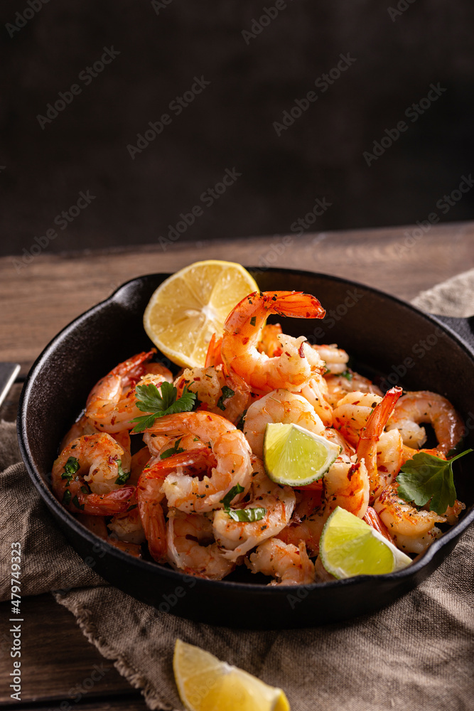 Delicious sea food, grilled shrimps with lemon