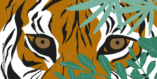 Fototapeta Naklejka Na Ścianę i Meble -  tiger in tropical leaves. eyes of a predatory animal. symbol of 2022
