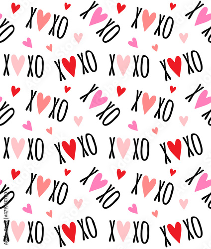 Vector seamless pattern of Valentine xoxo text and red hearts isolated on white background photo