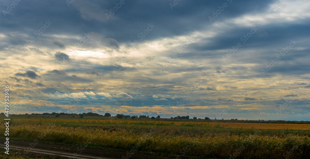 sunrise and clouds over the field in  autumn