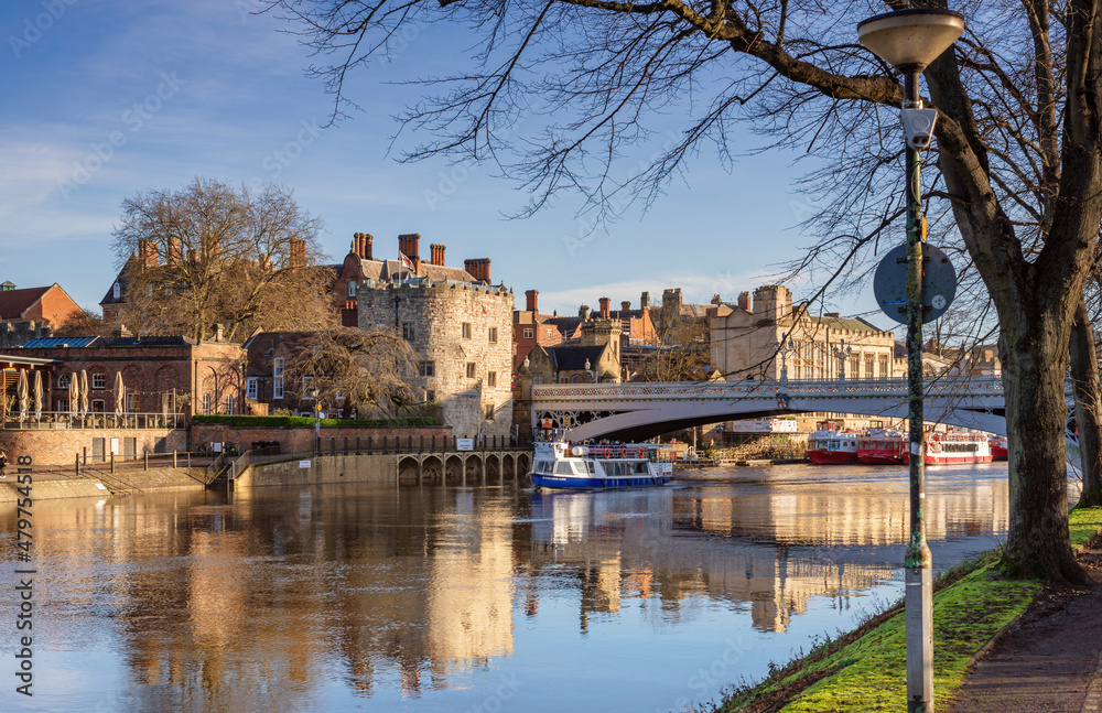 Obraz premium Historic iron bridge and tour boat.
