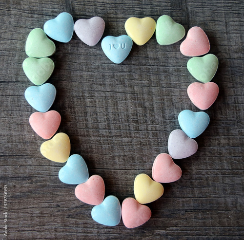Colorful candy hearts with loving messages are a traditional treat on Valentine`s Day. photo