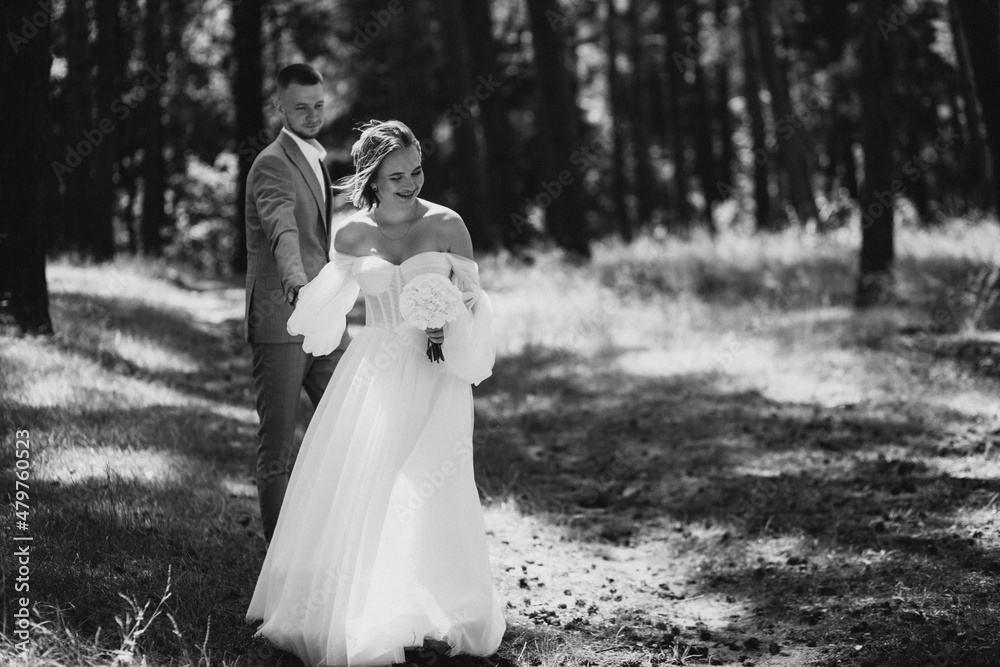 Young wedding couple having photoshoot in forest Young wedding couple having photoshoot in forest