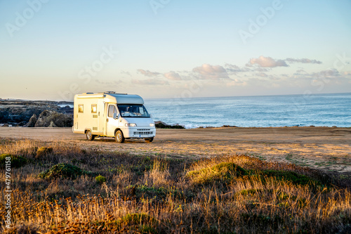 A small motor home parked by the beach on Vicentina Coast, Portugal photo