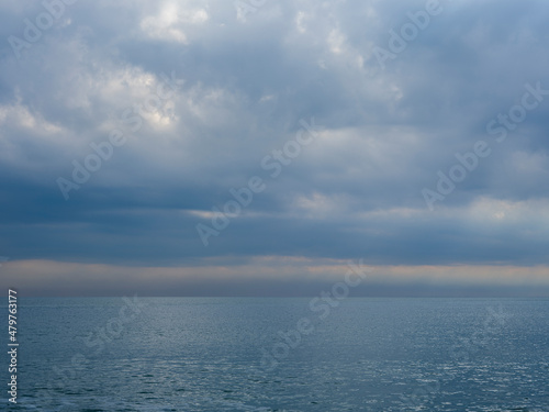 dramatic sky and tranquil seascape © enginakyurt