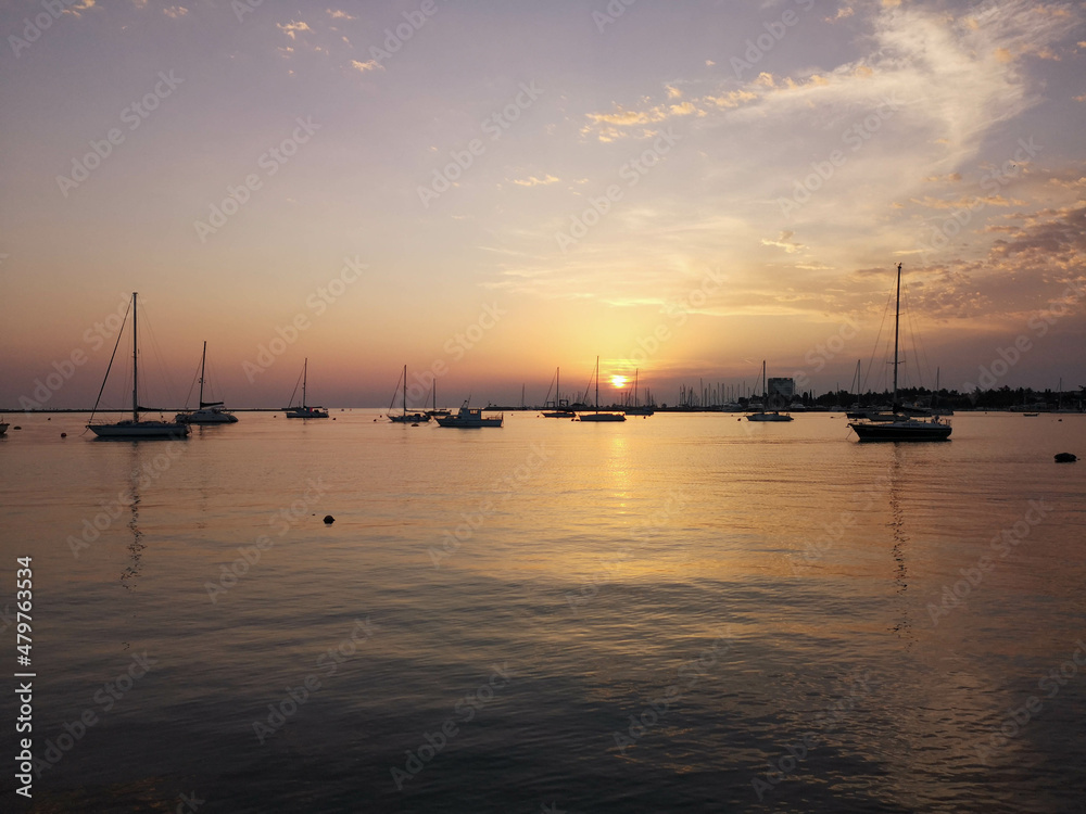 Sunset at the sea near yacht port