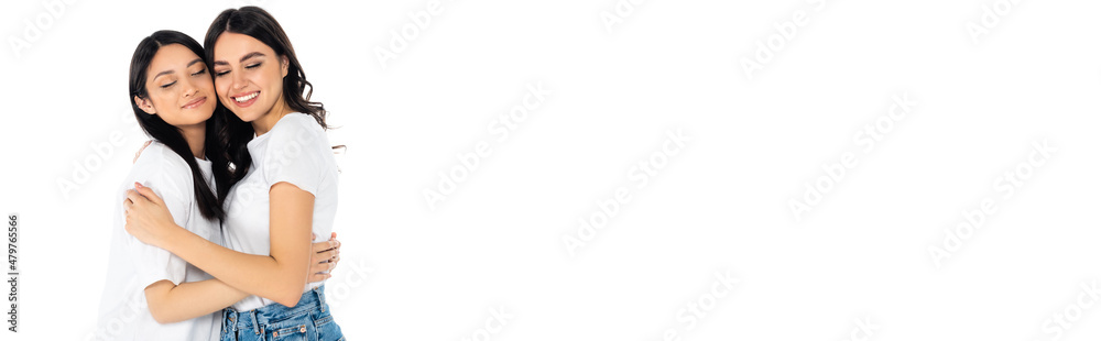 cheerful brunette women embracing with closed eyes isolated on white, banner. cheerful brunette women embracing with closed eyes isolated on white, banner.