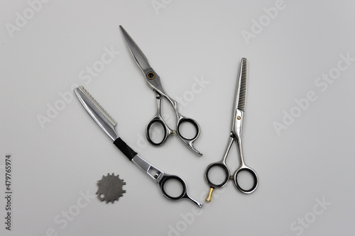 professional scissors and razor turn into a light background