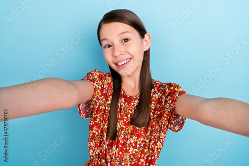 Photo of young cheerful lady shoot selfie picture travel vacation isolated over blue color background