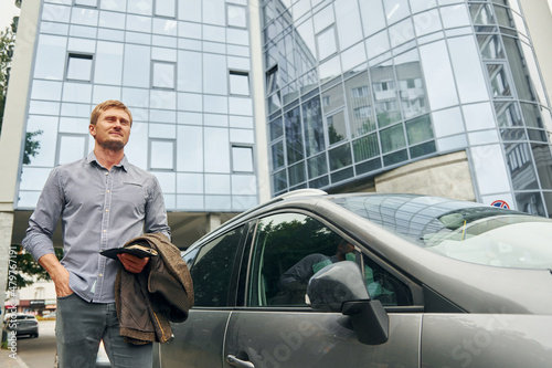 Man having a walk outdoors in the city at daytime