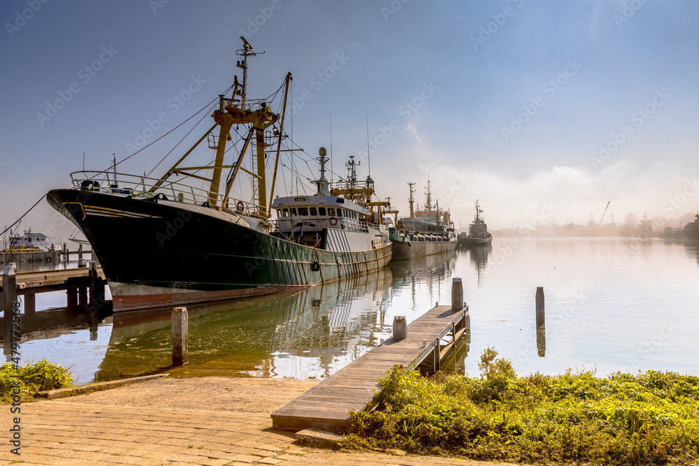 Modern fishing ships in hazy weather haringvliet Zeeland
