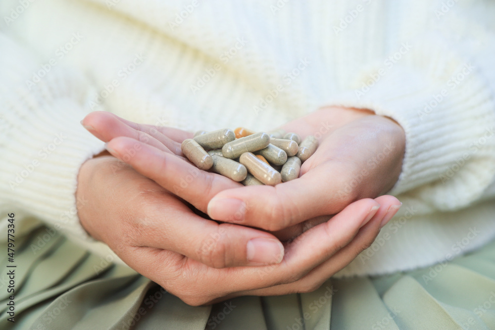 omplementary and alternative herbal supplements from organic herb for health care eating on girl hand. healthy eating for good living life. omplementary and alternative herbal supplements from organic herb for health care eating on girl hand. healthy eating for good living life.