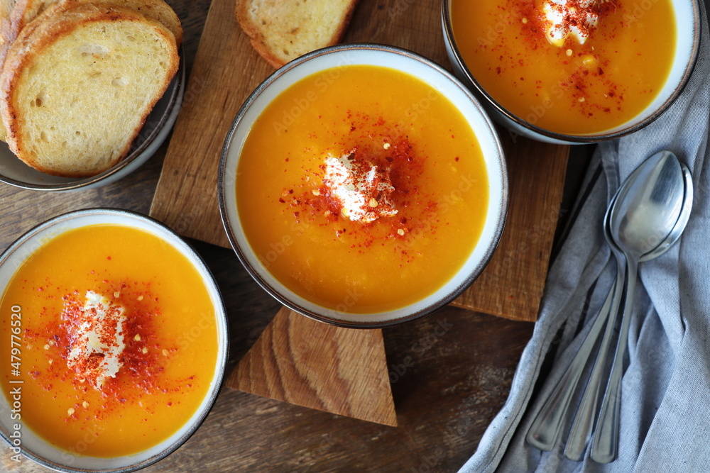 Thanksgiving concept with pumpkin soup .Fall table setting for celebration Autumn holiday with soup. Thanksgiving concept with pumpkin soup .Fall table setting for celebration Autumn holiday with soup.