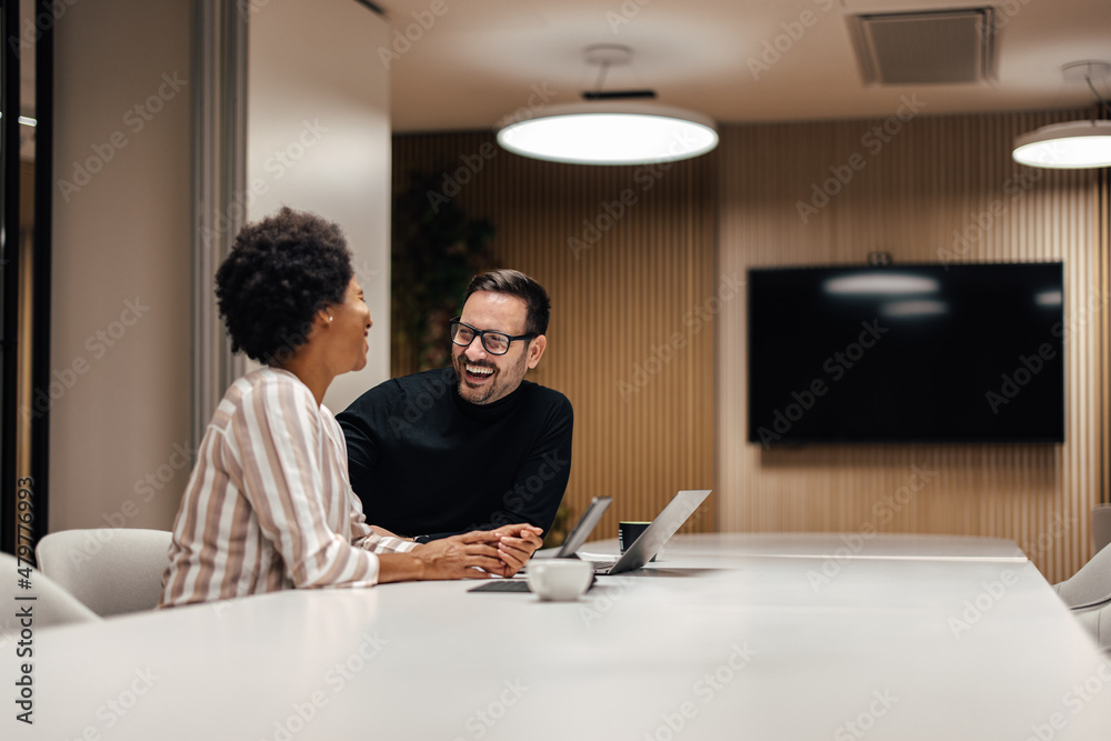 Laughing caucasian man, trying to make a relaxing atmosphere in the office. Laughing caucasian man, trying to make a relaxing atmosphere in the office.