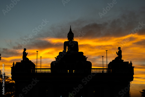 silhouette of a buddha statue