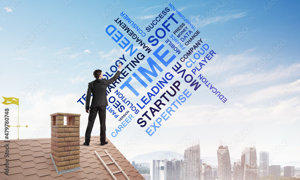 Young businessman standing on house roof and writing leadership skill concept. Mixed media Young businessman standing on house roof and writing leadership skill concept. Mixed media