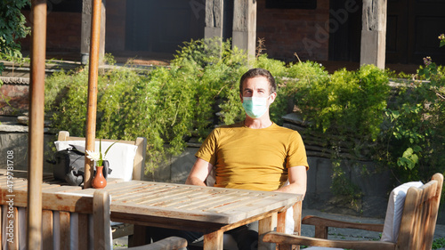 Male person waiting for his breakfast in a hotel in Kathmandu, Nepal. photo