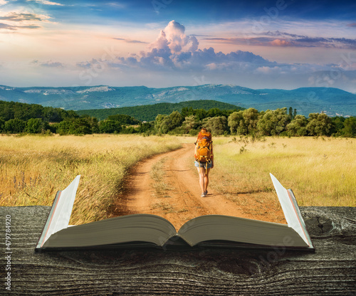 Girl hiker on a trail on the pages of book