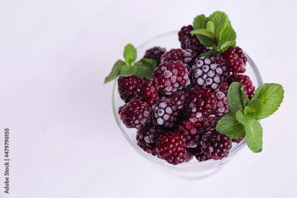 berries with leaf in a glass berries with leaf in a glass